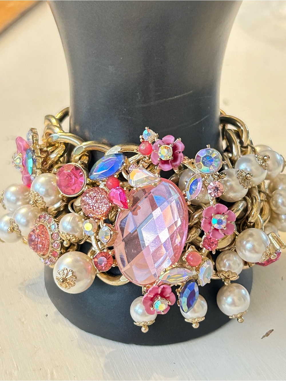 Betsey Johnson multi-strand gold-tone bracelet with faux pearls, pink appliques